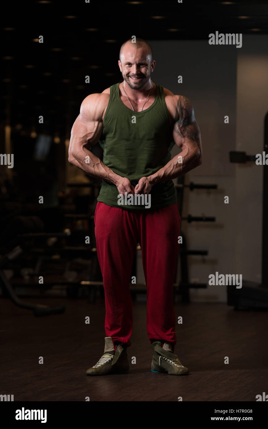 Bodybuilder Posing In Different Poses Demonstrating Their Muscles Male Showing Muscles