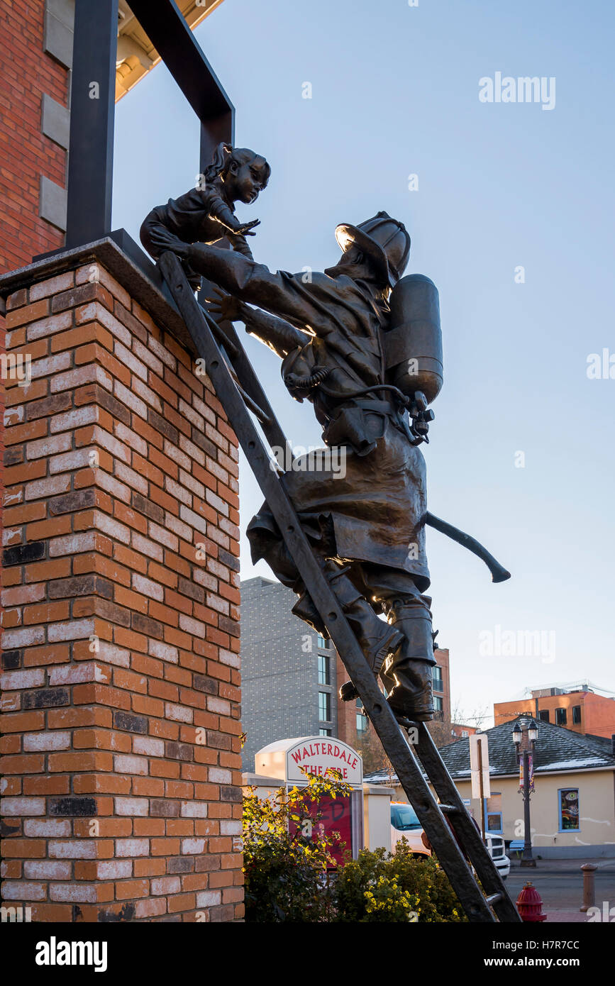 Fireman rescue sculpture, Old Strathcona, Edmonton, Alberta, Canada. Stock Photo