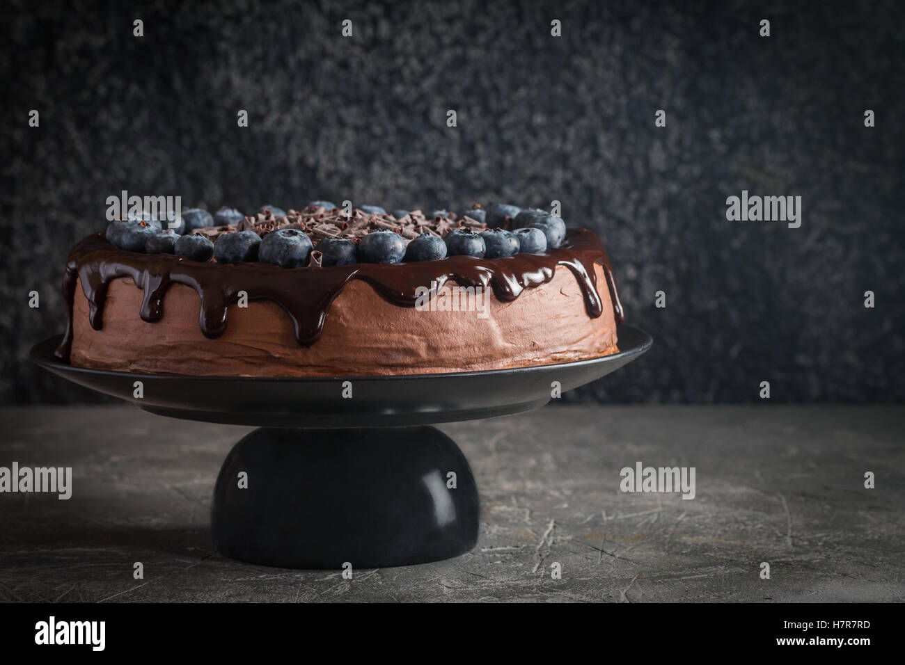 super chocolate cake with chocolate sauce and blueberry Stock Photo - Alamy