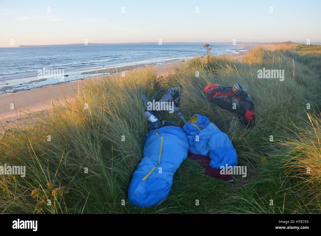 Wild camping in the dunes on a backpacking trip in Scotland Stock Photo