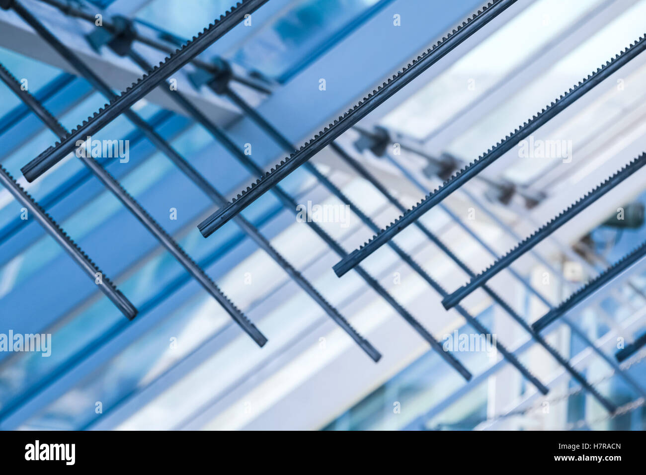 Opening drive racks. Abstract high-tech architecture background, internal details of glass roof with lockable windows sections, Stock Photo