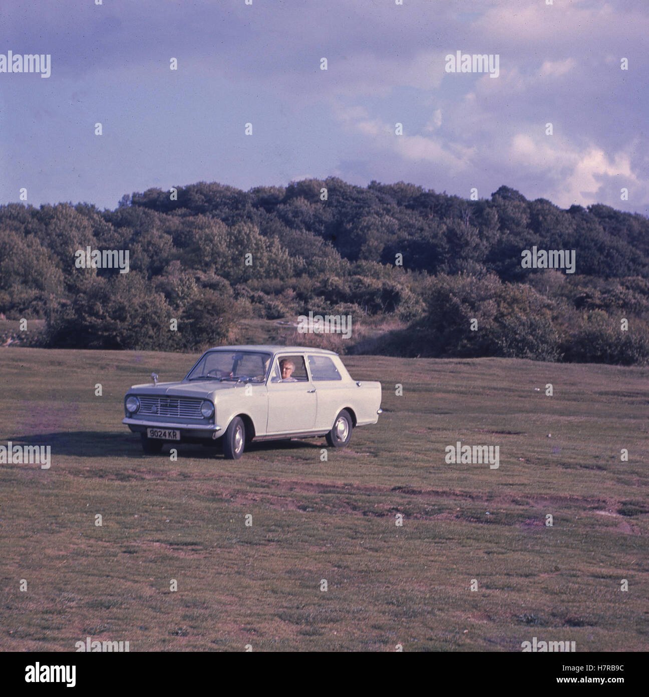 1960s, historical, Small compact family car, the 2-door saloon Vauxhall Viva HA parked outside in a field. Stock Photo