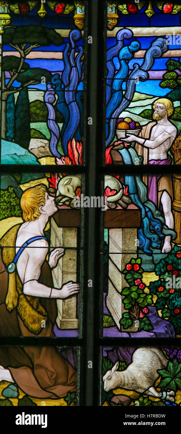 Stained Glass window depicting a sacrifice of lambs in the Cathedral of St Rumbold of Mechelen, Belgium. Stock Photo