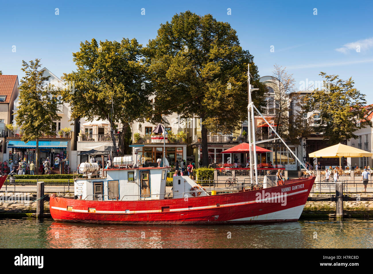 Fishing boat, the Hanno Gunther, Alter Strom Canal, and Am Strom Street, Warnemunde, Germany Stock Photo