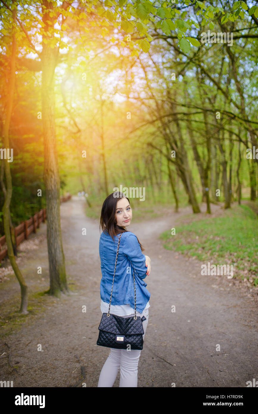 Young girl on a walk in the forest Stock Photo - Alamy
