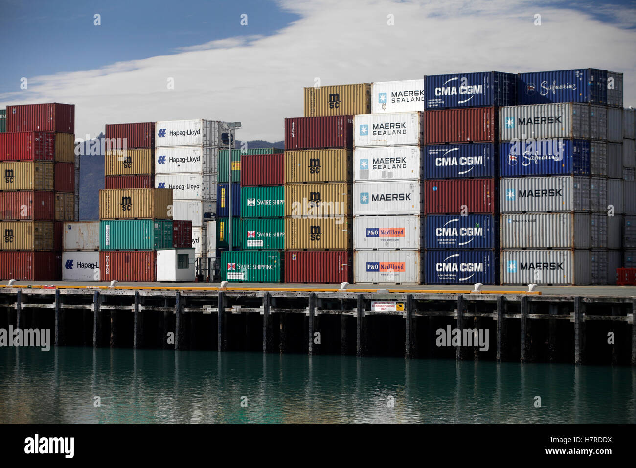 Shipping containers on the quayside at Port Nelson New Zealand Stock