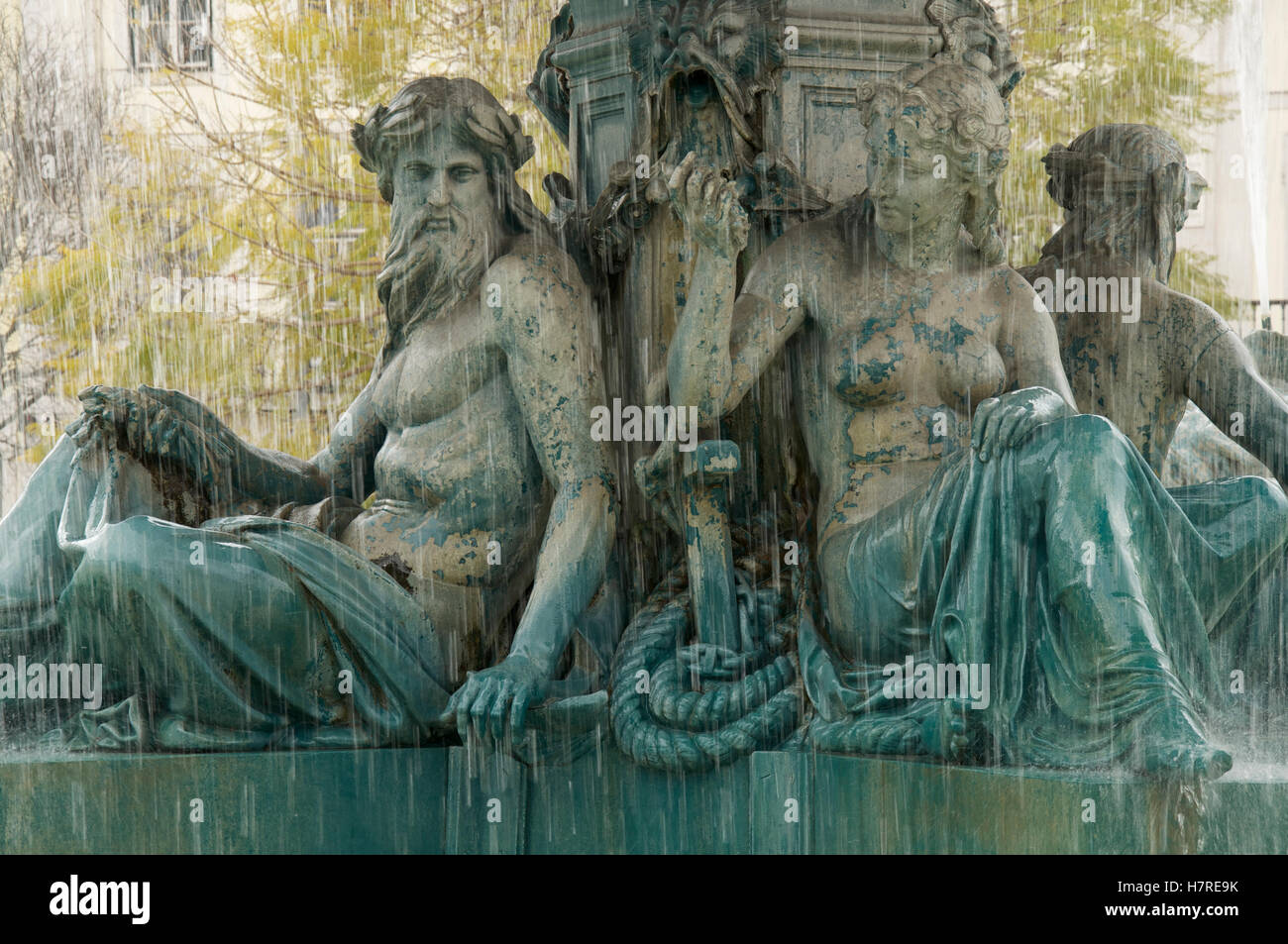 Neoclassical fountain. Bronze statues of nude classical mythological figures adorn the fountains in the Praça Dom Pedro IV. Rossio, Lisbon, Portugal. Stock Photo