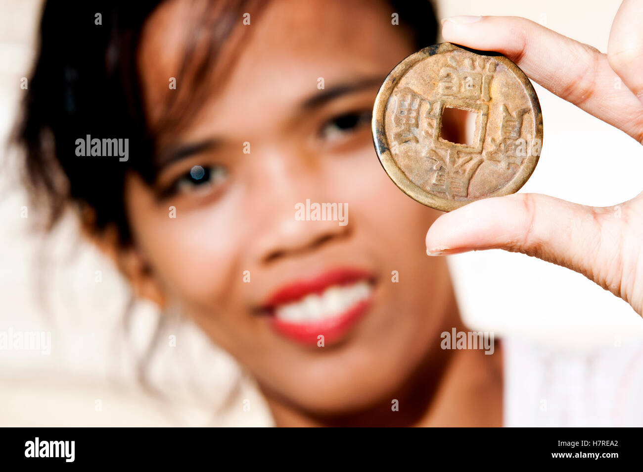 young woman with stamp collection as hobby Stock Photo Alamy