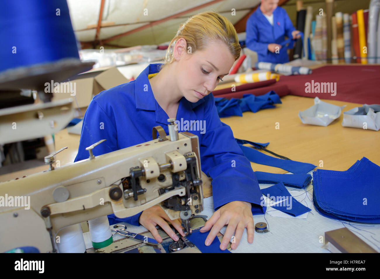 Woman using industrial sewing machine hi-res stock photography and ...