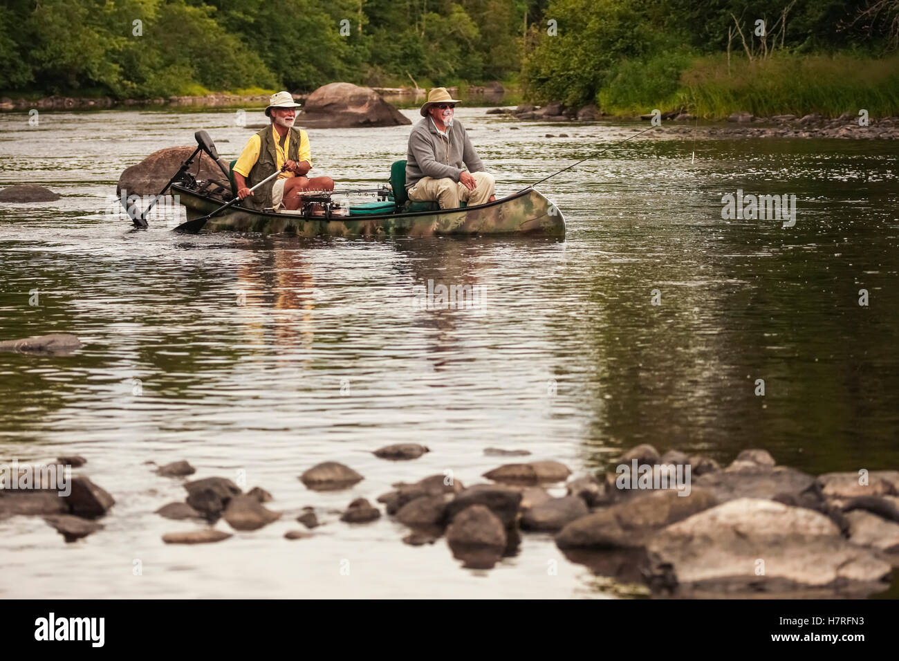 Bass Fishermen In Canoe In A River Stock Photo