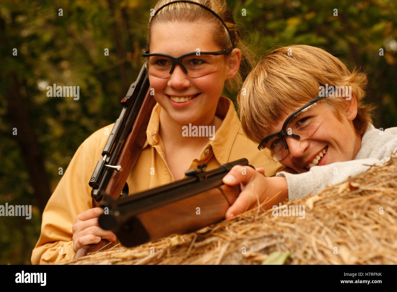 Teenage Boy And Girl Squirrel Hunting With Pellet Gun Stock Photo Alamy