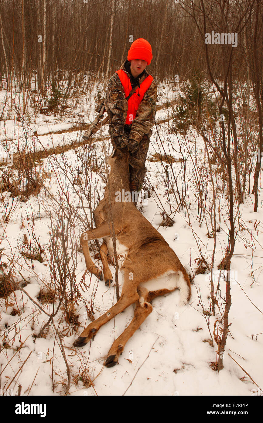 Youth Hunter With First Deer Dragging In Field Stock Photo Alamy