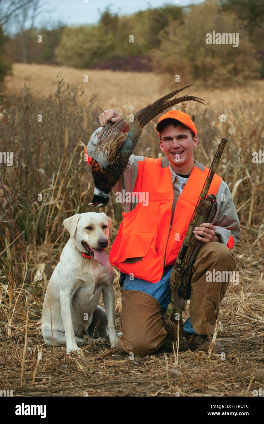 Yellow Lab And Young Male Upland Bird Hunter Stock Photo
