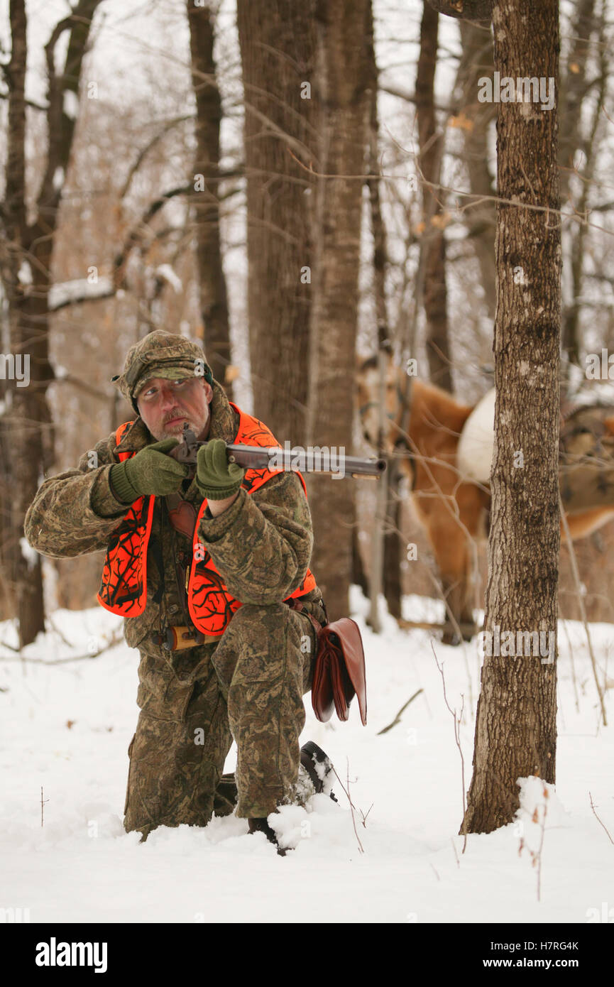 Muzzleloader Hunter With Horse Hunting In Winter Stock Photo