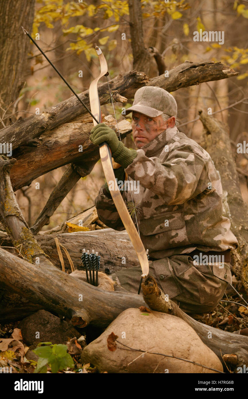 Big Game Hunter Shoots Longbow Stock Photo