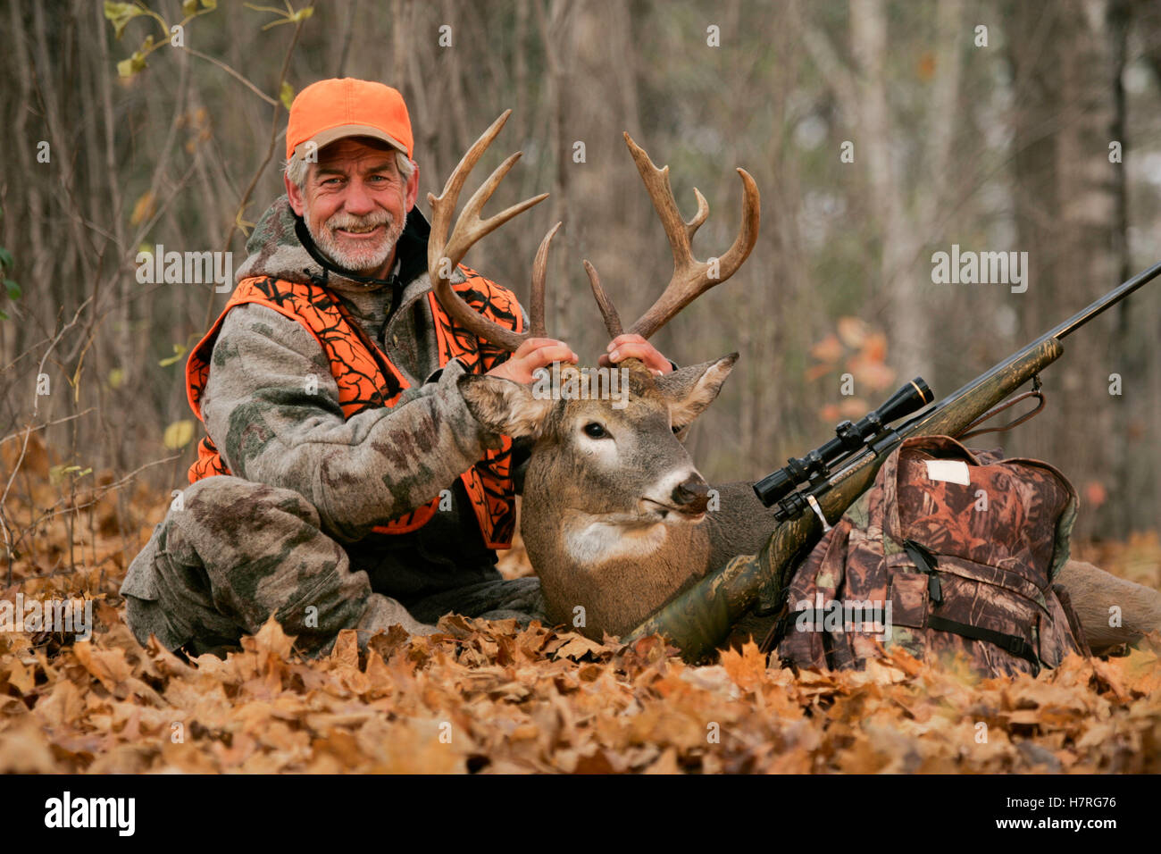 Deer Hunter With Dead Deer Stock Photo