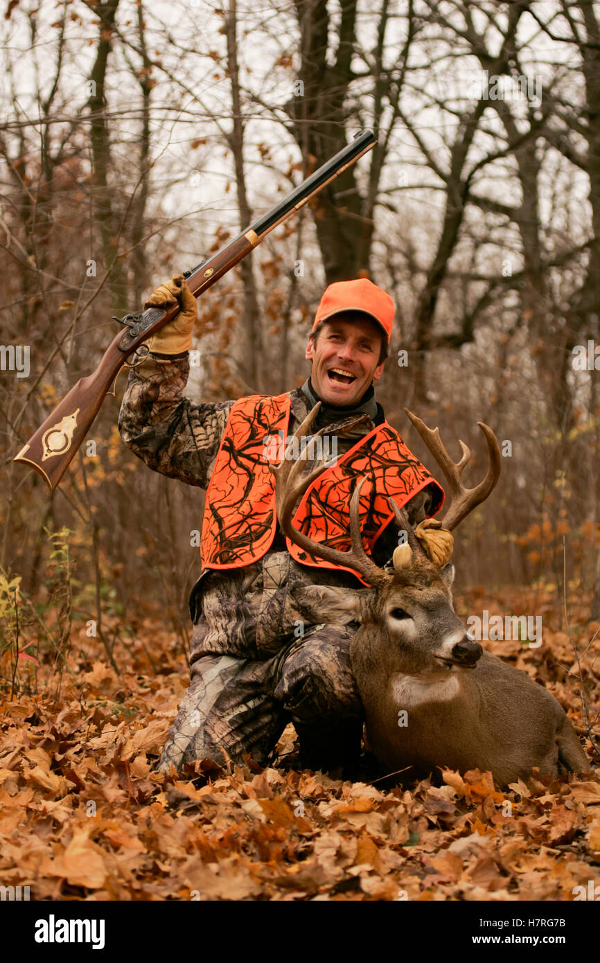 Deer Hunter With Dead Deer Stock Photo