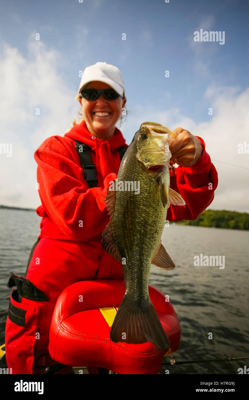 Woman Bass Fishing In A Lake Stock Photo Alamy
