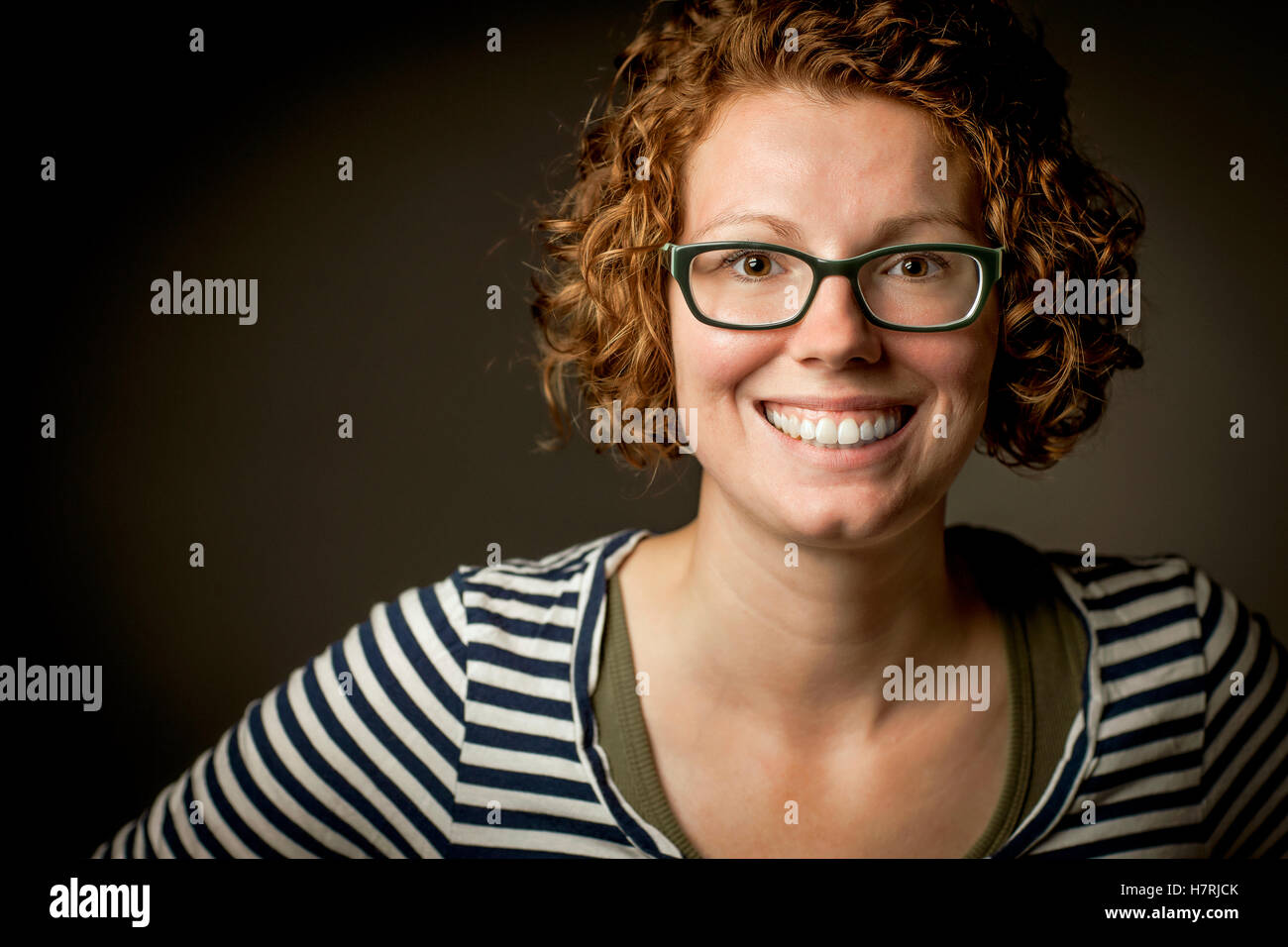 Woman curly hair glasses hi-res stock photography and images - Alamy