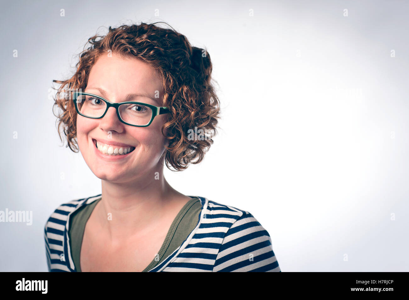 Woman curly hair glasses hi-res stock photography and images - Alamy