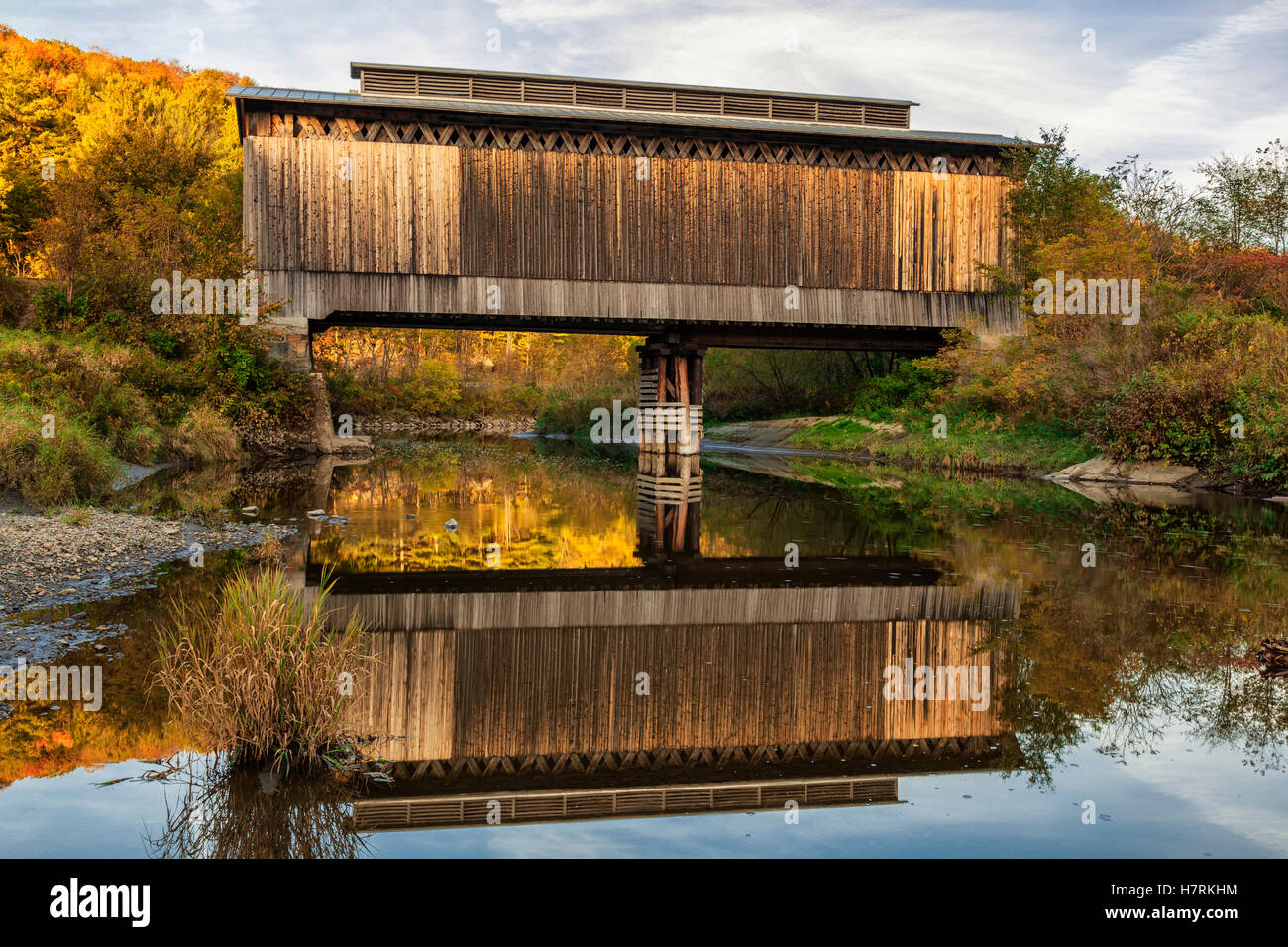 Fisher covered railroad bridge over Lamoille River in autumn; Wolcott, Vermont, United States of America Stock Photo