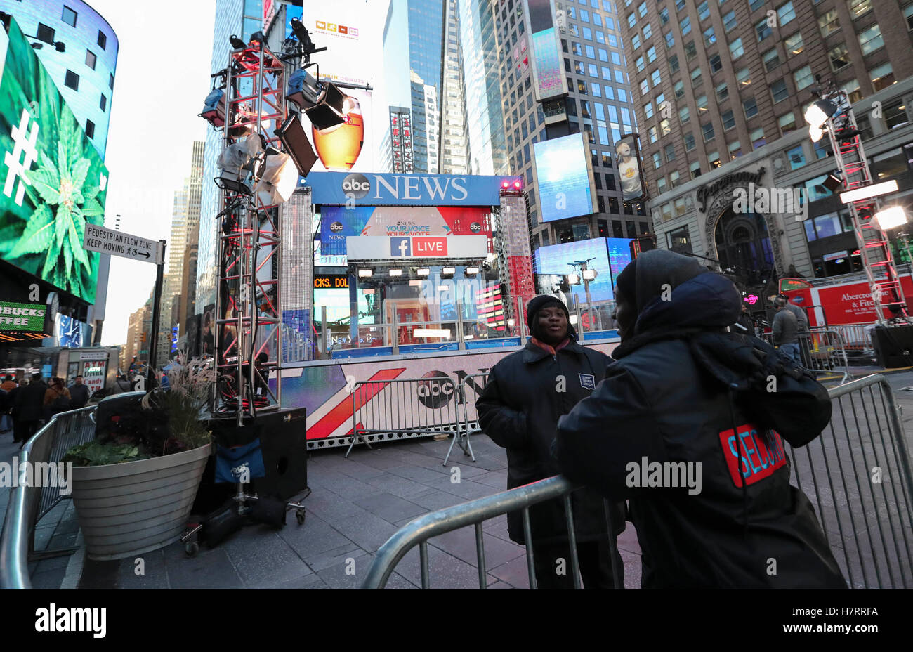 New York, USA. 7th Nov, 2016. Security personel talk in front of a media stage for live broadcast of the voting day at the Times Square in New York, the United States, Nov. 7, 2016. The U.S. general election will be held on Nov. 8. Credit:  Wang Ying/Xinhua/Alamy Live News Stock Photo