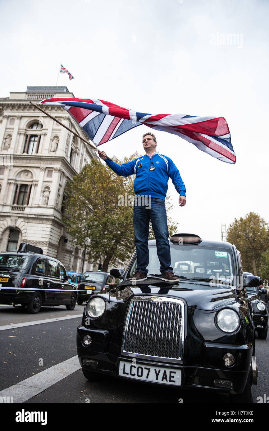 London, UK. 8th November, 2016. Black cab drivers representing the United Cabbies Group (UCG), London Cab Drivers Club and RMT block Whitehall as part of a protest intended to apply pressure on the Government to launch a public inquiry into Transport for London’s (TfL) management of traffic and transport infrastructure and its failure to prevent congestion and increased pollution in London. Credit:  Mark Kerrison/Alamy Live News Stock Photo