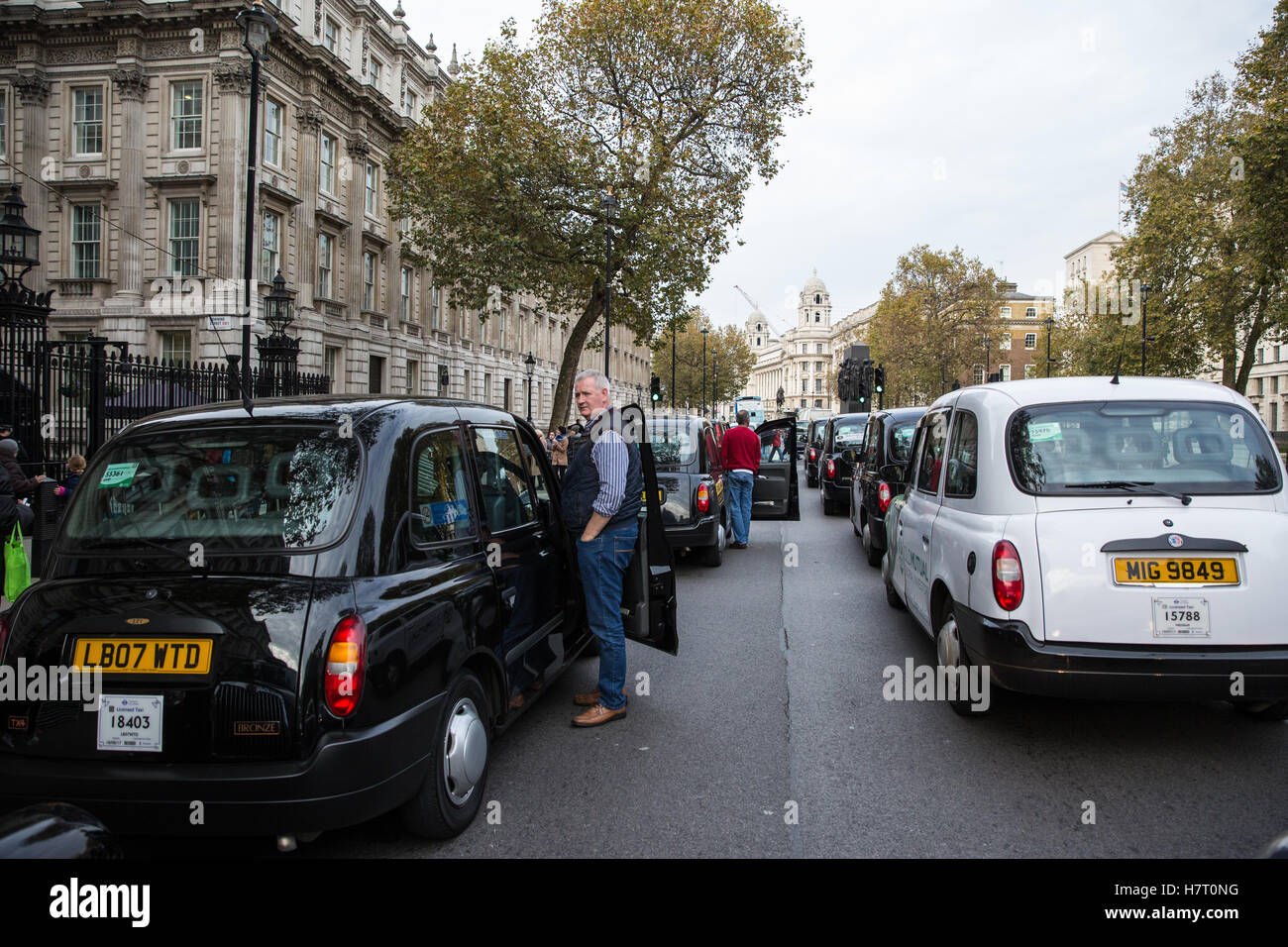 London, UK. 8th November, 2016. Black cab drivers representing the United Cabbies Group (UCG), London Cab Drivers Club and RMT block Whitehall as part of a protest intended to apply pressure on the Government to launch a public inquiry into Transport for London’s (TfL) management of traffic and transport infrastructure and its failure to prevent congestion and increased pollution in London. Stock Photo
