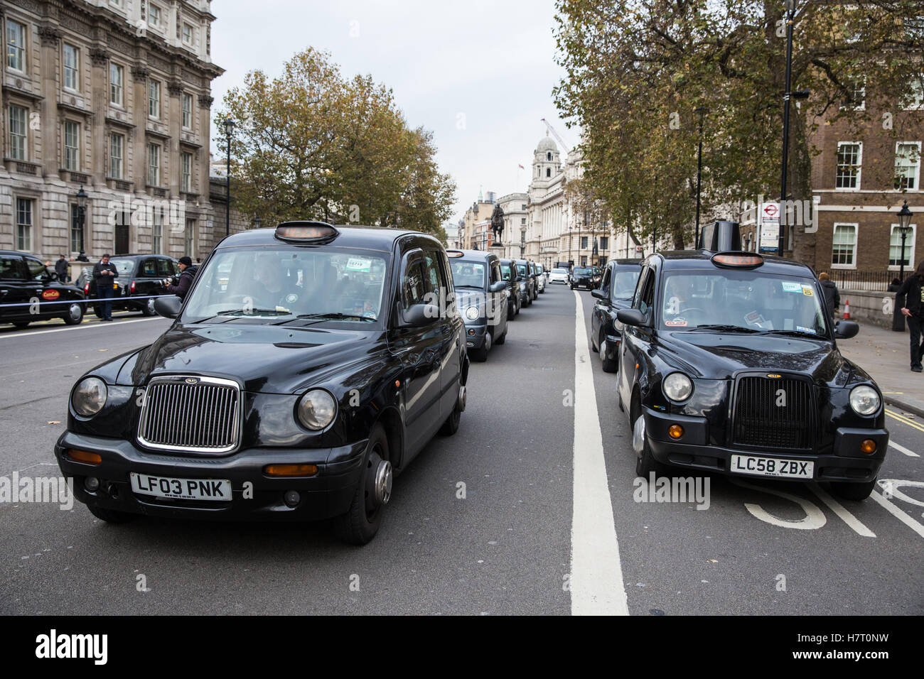 London, UK. 8th November, 2016. Black cab drivers representing the United Cabbies Group (UCG), London Cab Drivers Club and RMT block Whitehall as part of a protest intended to apply pressure on the Government to launch a public inquiry into Transport for London’s (TfL) management of traffic and transport infrastructure and its failure to prevent congestion and increased pollution in London. Stock Photo