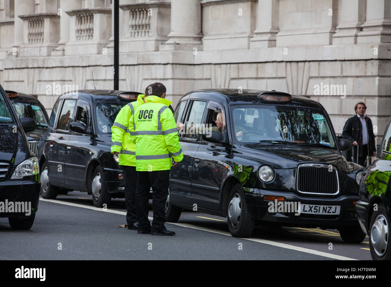 London, UK. 8th November, 2016. Black cab drivers representing the United Cabbies Group (UCG), London Cab Drivers Club and RMT block Whitehall as part of a protest intended to apply pressure on the Government to launch a public inquiry into Transport for London’s (TfL) management of traffic and transport infrastructure and its failure to prevent congestion and increased pollution in London. Stock Photo