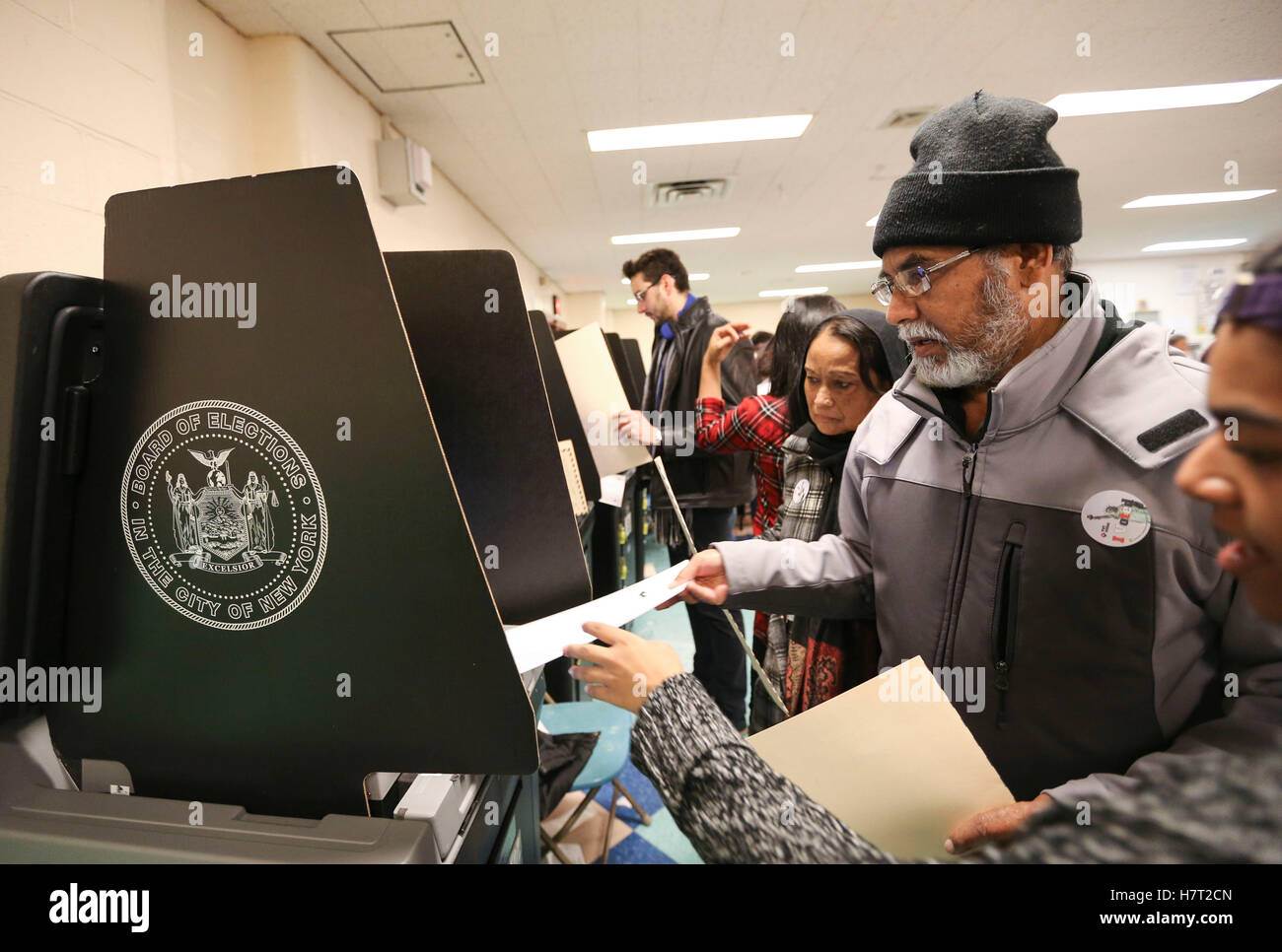 New York, USA. 8th Nov, 2016. A voter casts his ballot at a polling station in Queens, New York, the United States, Nov. 8, 2016. The U.S. presidential elections kicked off on Tuesday. Credit:  Wang Ying/Xinhua/Alamy Live News Stock Photo