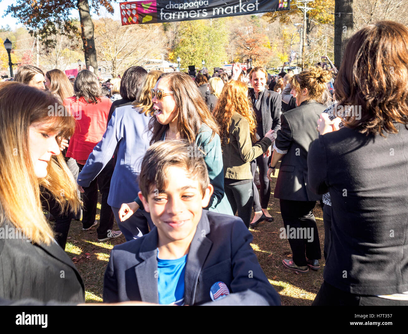 Chappaqua, NY, USA - 8 November 2016. Members of a Pantsuit Up flash mob dancing in presidential candidate Secretary of State Hillary Clinton's home town of Chappaqua, New York at the Chappaqua Train Station on Election Day. Credit:  Marianne A. Campolongo/Alamy Live News Stock Photo