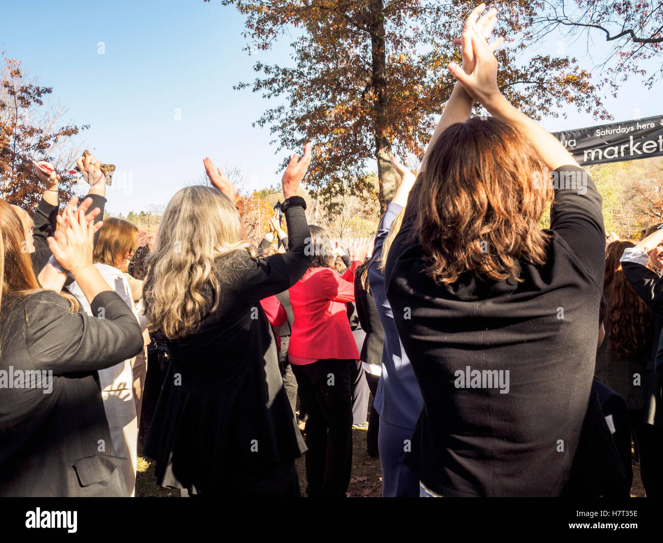 Chappaqua, NY, USA - 8 November 2016. Members of a Pantsuit Up flash mob dancing in presidential candidate Secretary of State Hillary Clinton's home town of Chappaqua, New York at the Chappaqua Train Station on Election Day. Credit:  Marianne A. Campolongo/Alamy Live News Stock Photo