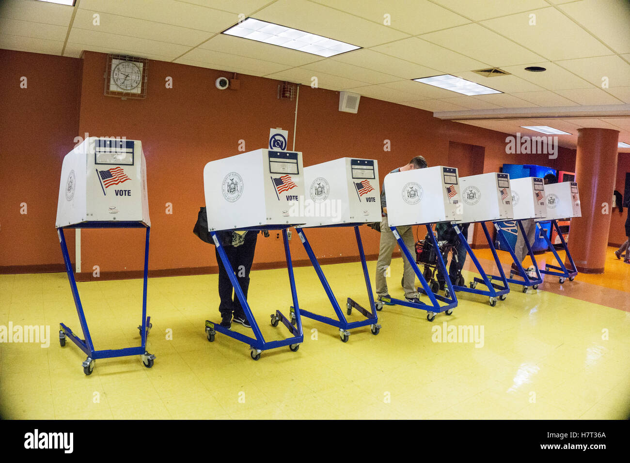 New York, USA. 8th November, 2016. line of voting kiosks where voters fill out ballots before proceeding to scanning machines at Park West Vocational High School in Hells Kitchen neighborhood. Park West High School gathers teens from many boroughs to train as cooks. Credit:  Dorothy Alexander/Alamy Live News Stock Photo