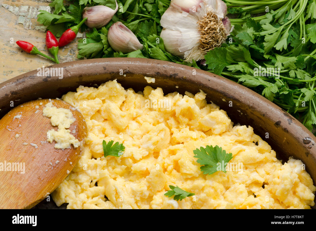 Scrambled eggs with garlic and parsley Stock Photo Alamy