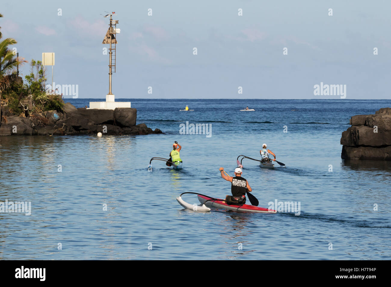 Outrigger canoes heading out of Honokohau Harbor, Kona coast; Kona
