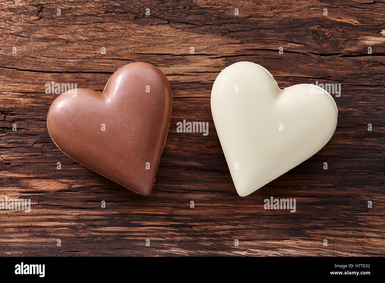 Chocolate hearts on wooden background Stock Photo