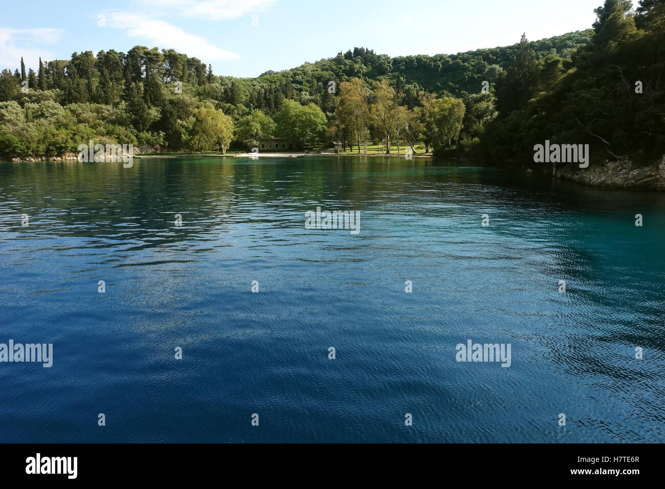 Skorpios, GREECE, May 11, 2013: Landscape with green garden and small ...
