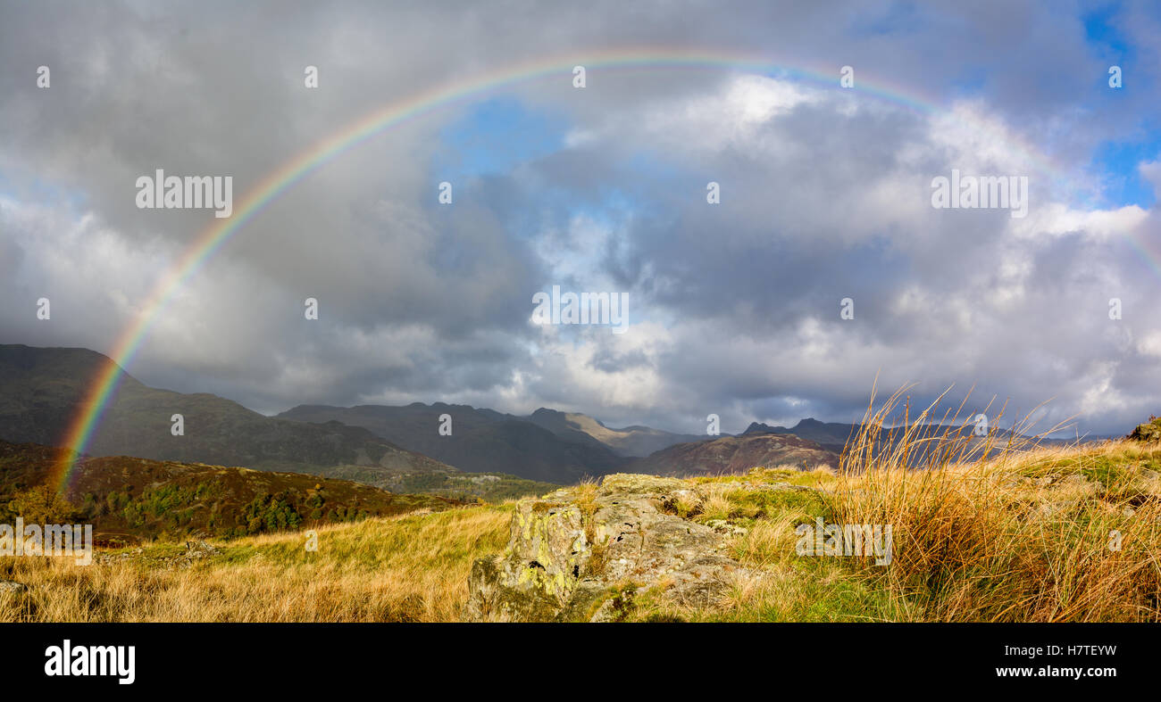 Rainbow over the Coniston Range of fells in the Lake District Stock Photo