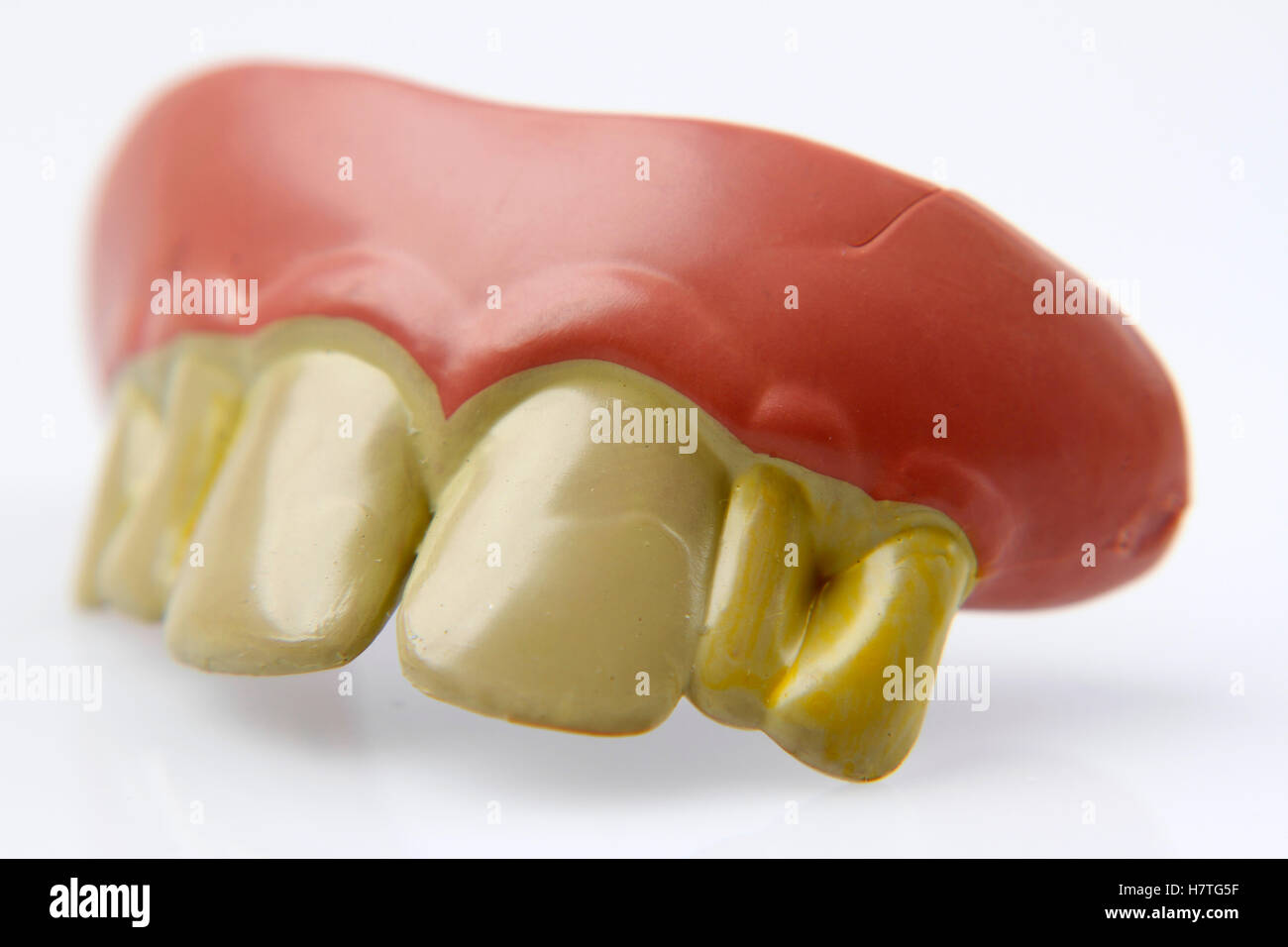 Novelty teeth on plain background Stock Photo Alamy