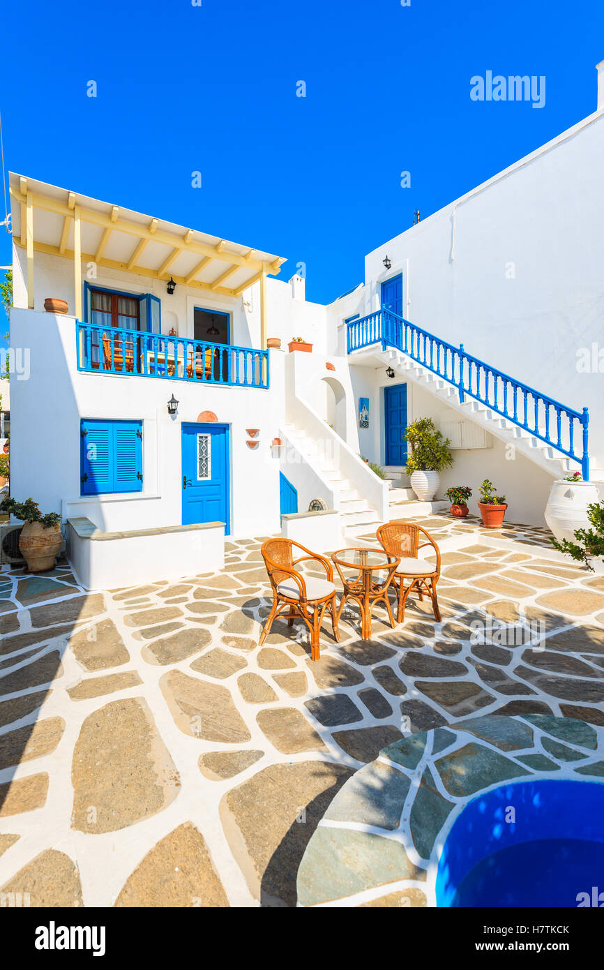 NAOUSSA TOWN, PAROS ISLAND MAY 19, 2016 table with chairs on courtyard of typical Greek style