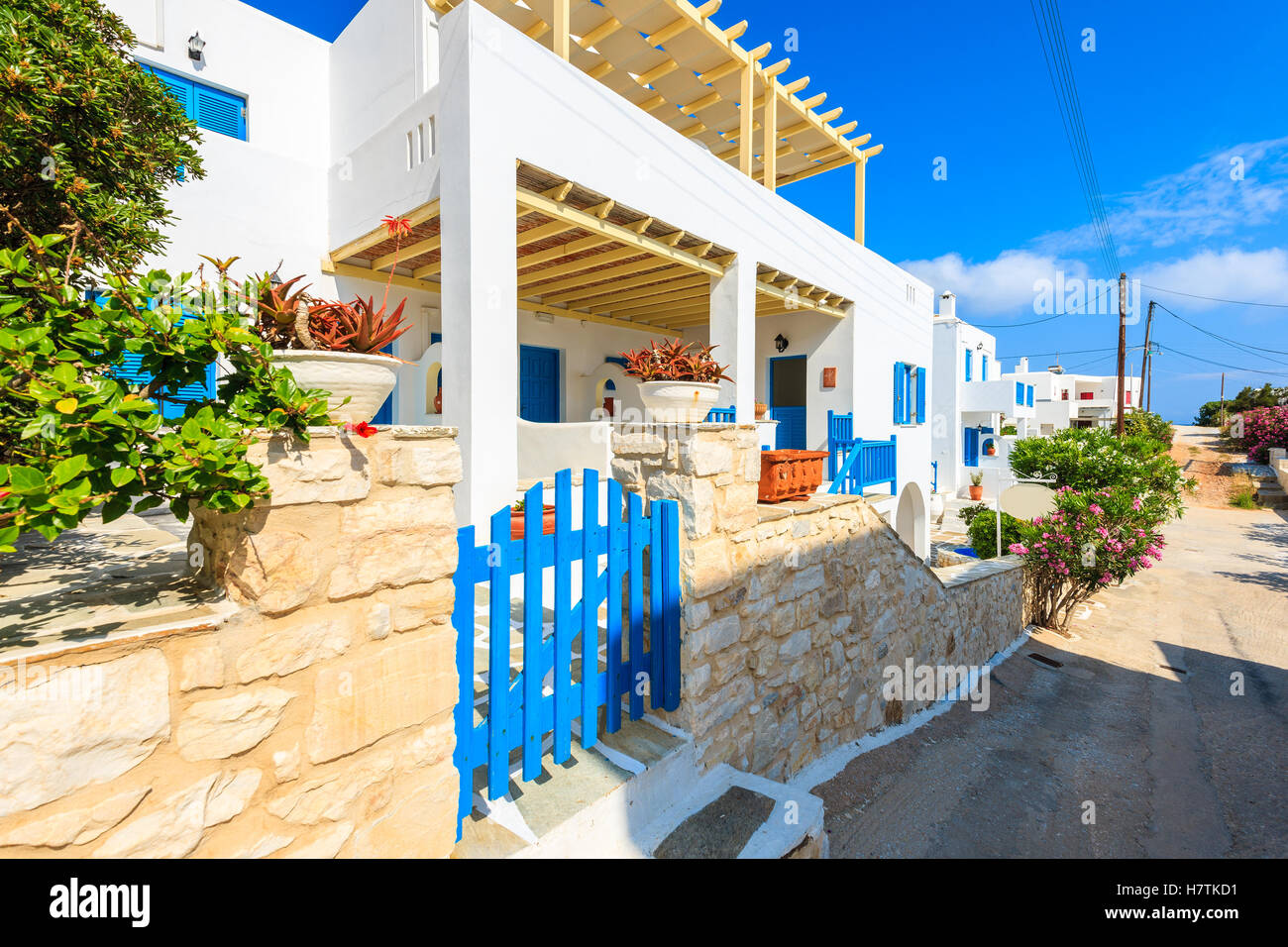 Street with typical Greek style apartments in Naoussa town on Paros