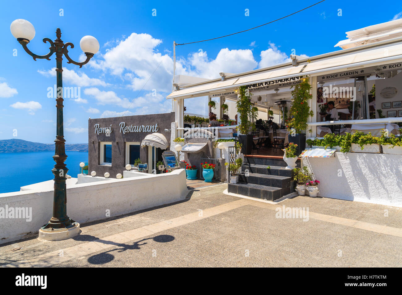 SANTORINI ISLAND, GREECE - MAY 22, 2016: typical Greek restaurant in Firostefani village on Santorini island, Greece. Stock Photo