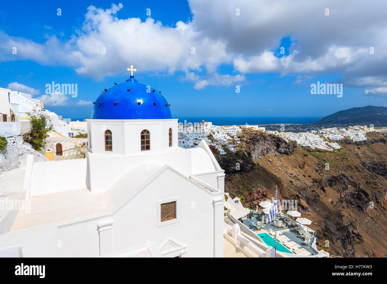 Blue dome of church in Imerovigli village and view of blue sea with caldera on Santorini island, Greece Stock Photo