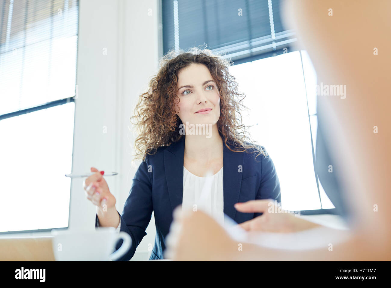Competent businesswoman during negotiation in start-up Stock Photo