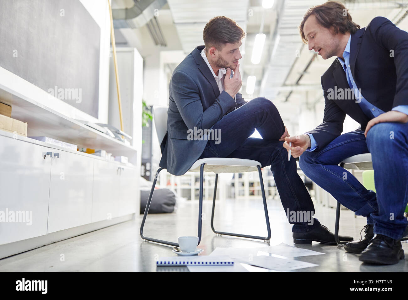 Two business people in dialogue during brainstorming Stock Photo
