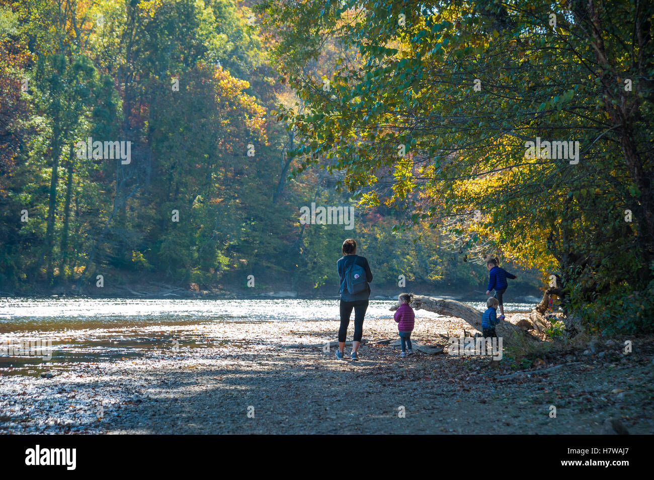 Mom with kids enjoying a beautiful Autumn day at the Chattahoochee River National Recreation Area at Paces Mill in Atlanta, GA. Stock Photo