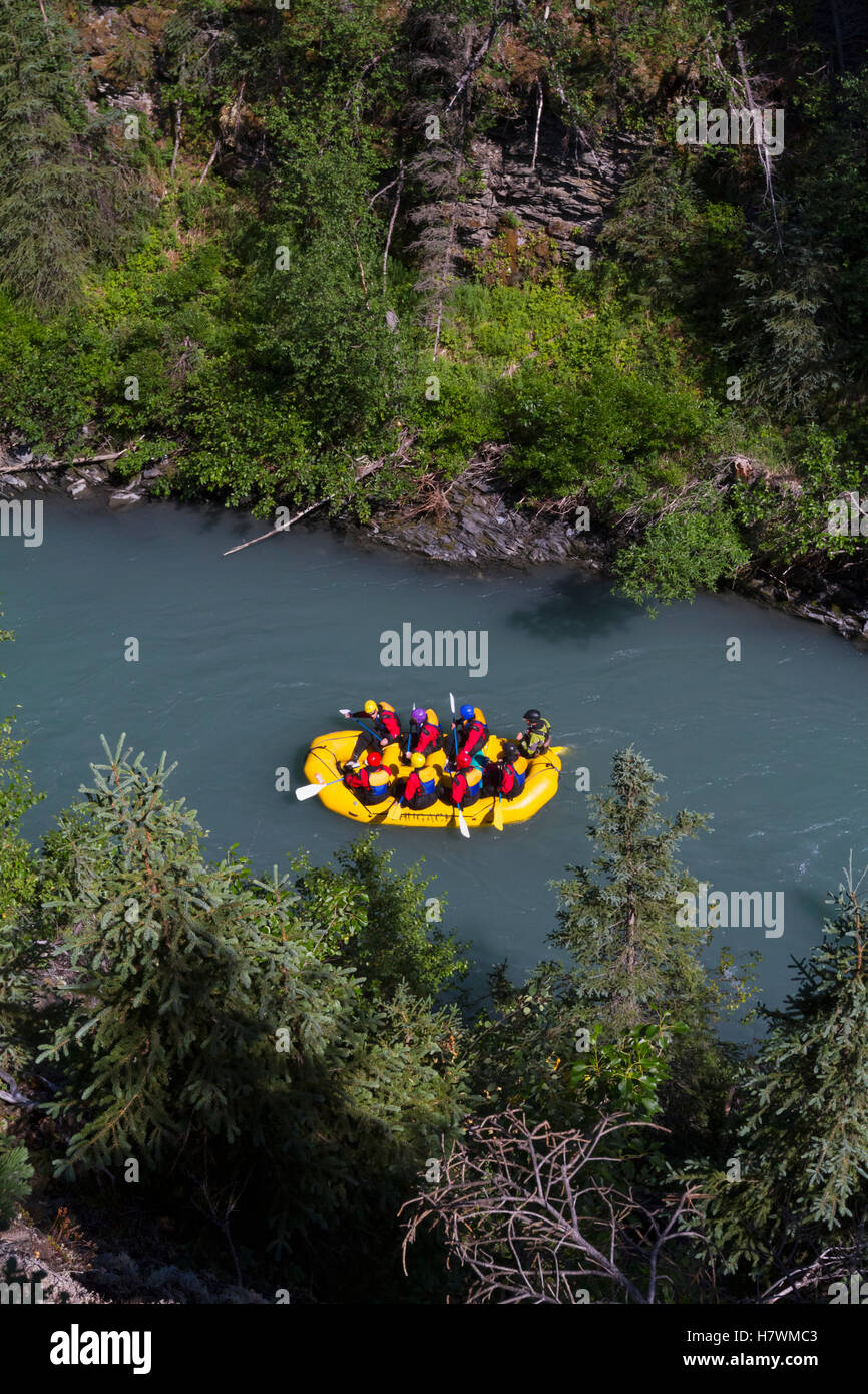 A raft full of people float down Six Mile Creek near Turnagain Pass and