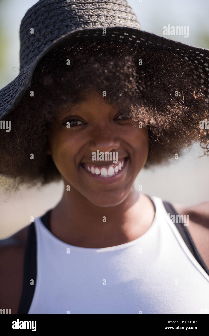 Close up portrait of a beautiful young african american woman smiling ...
