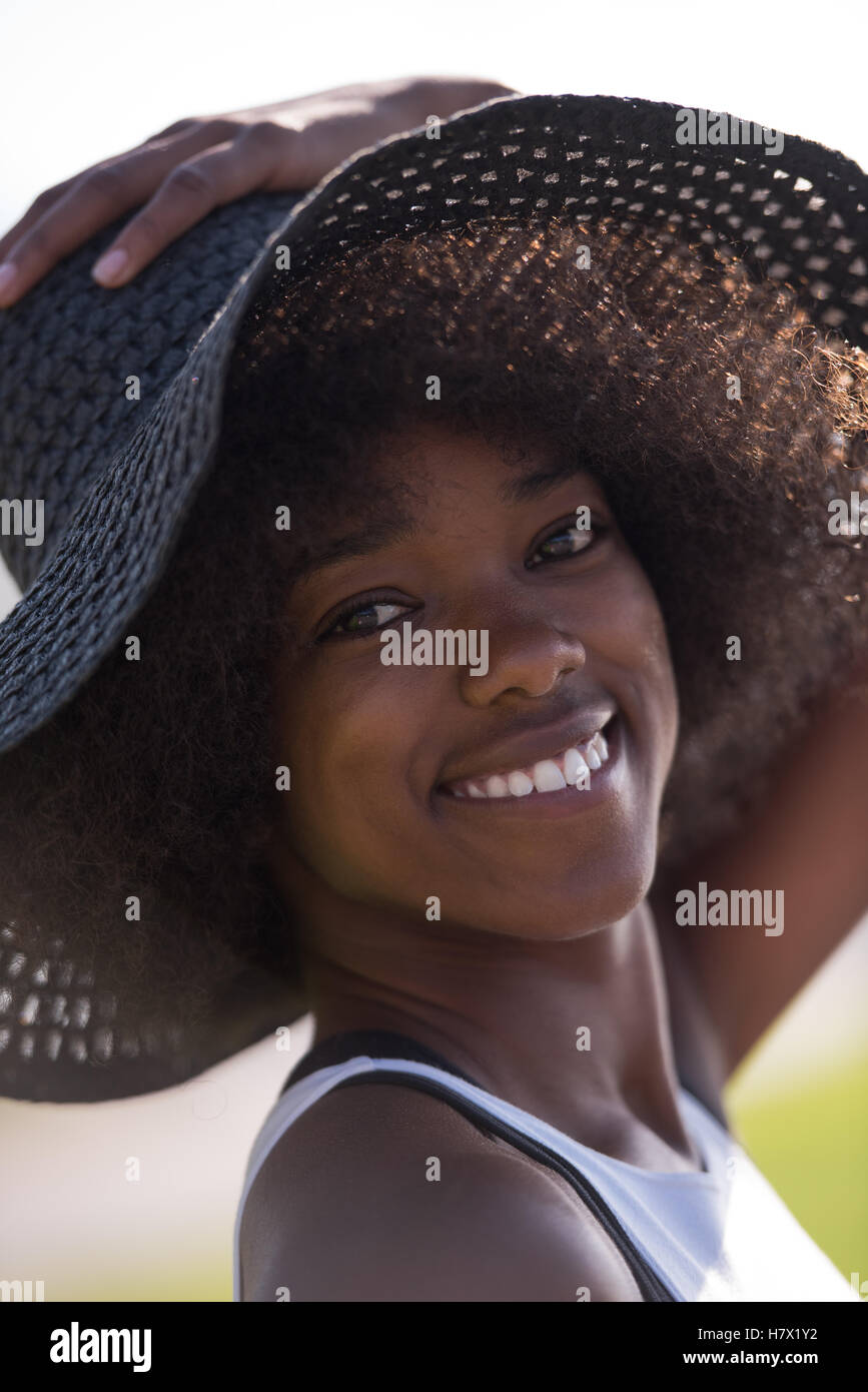 Close up portrait of a beautiful young african american woman smiling ...
